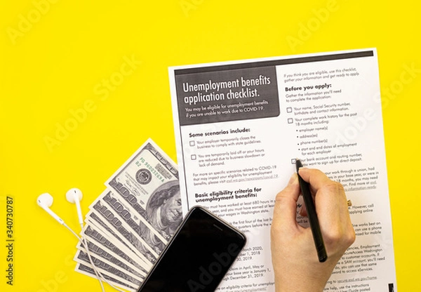 Obraz application for unemployment benefits with money. the concept of applying for insurance payments from the state in case of dismissal due to covid-19 coronavirus
