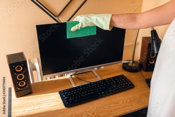 Obraz Beautiful caucasian woman cleans dust on furniture in room