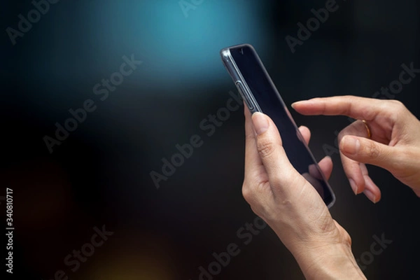 Fototapeta hand use smart phone with blur background