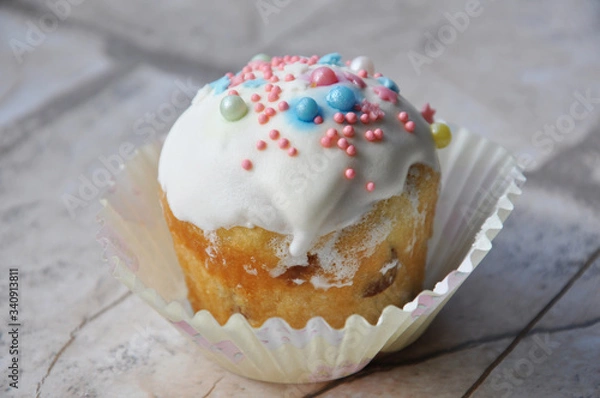 Fototapeta Easter cupcake with icing and sprinkles