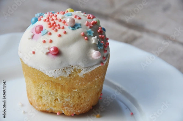 Fototapeta Easter cupcake with icing and sprinkles