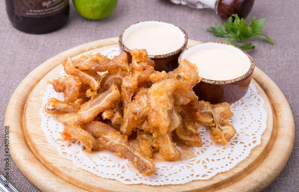 Obraz Fried pork ears served on board