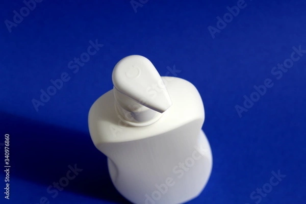 Obraz Plastic white container with dispenser for washing and disinfecting hands