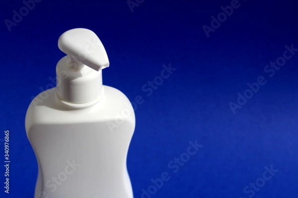 Obraz Plastic white container with dispenser for washing and disinfecting hands