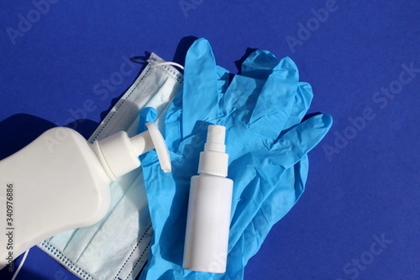Obraz Hand spray, white tube for disinfection, mask and gloves