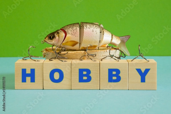 Fototapeta Fishing wobbler, fishing hooks, as a form of fascination. A place for a hobby text.