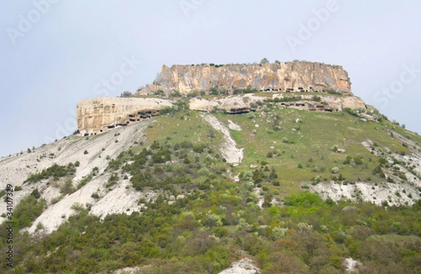 Fototapeta A rock with multiple caves inside