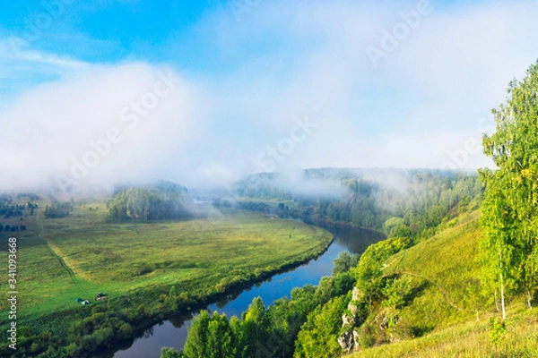 Fototapeta river and forest from a high hill on a summer morning
