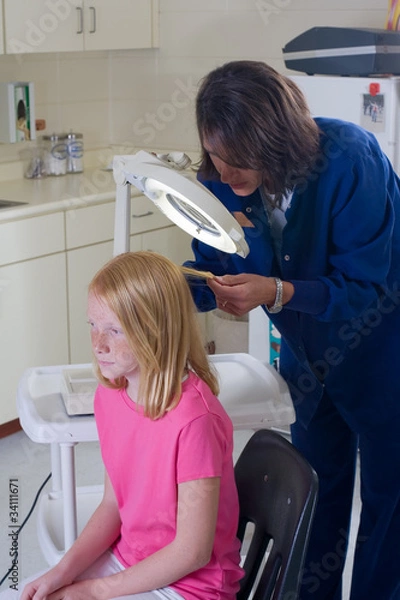 Obraz Nurse checking for head lice