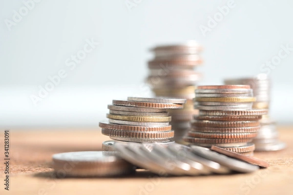 Obraz Business Concept, Finance Growth in investment for saving up money with coin stacked in pile on wooden background with copyspace