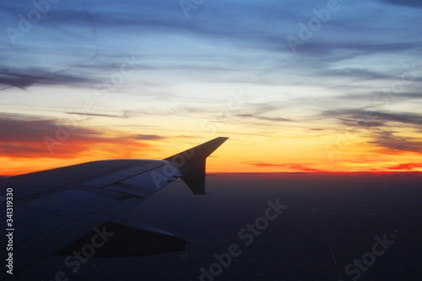 Obraz Bright sunrise from the airplane window