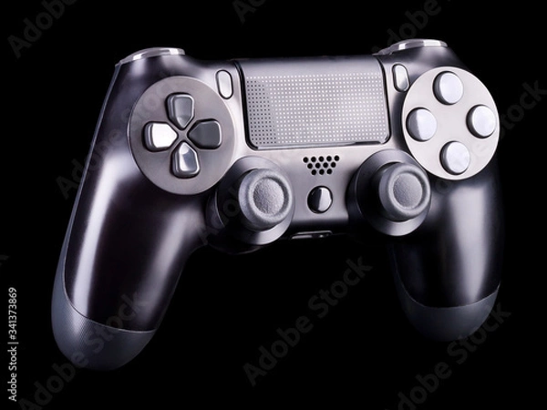 Fototapeta Black video game joystick gamepad isolated on a black background