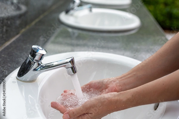 Obraz Washing hands in water running.