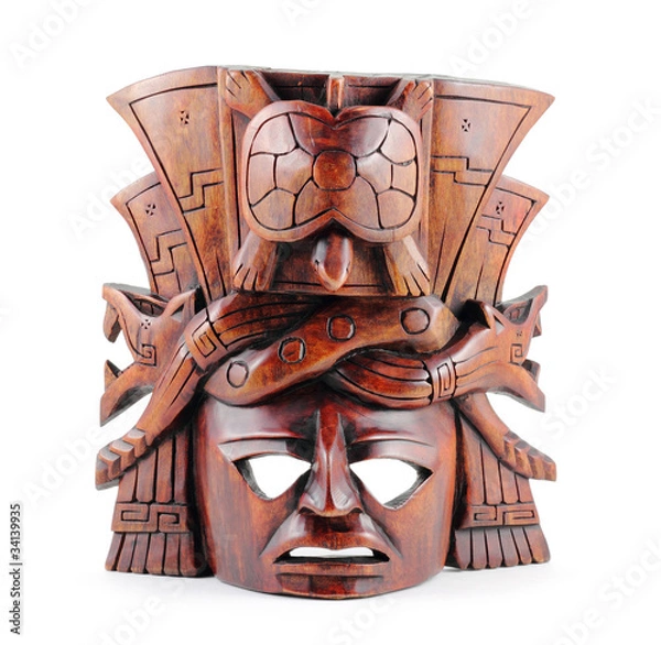 Fototapeta Hand carved Mayan mask isolated on a white background.