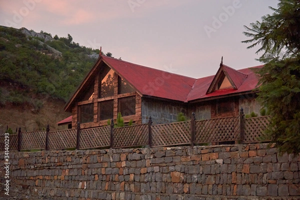 Obraz Red old wooden hut in the mountains