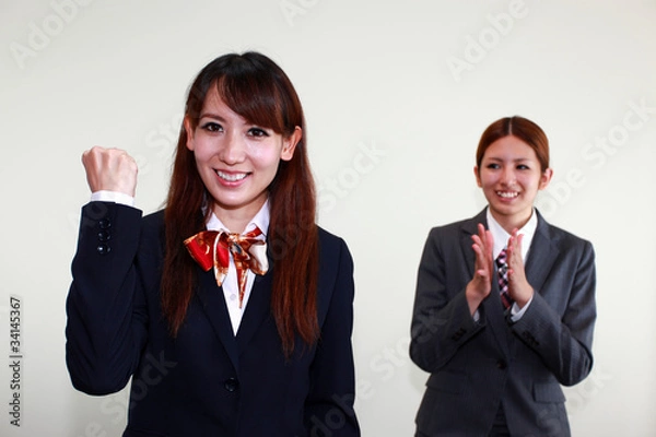 Fototapeta 成功を喜ぶ二人のオフィスレディー