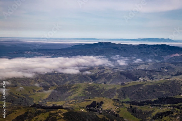 Obraz The Fog and Marine Layer Clears over the Rural Mountains and Valleys of San Mateo County, California, USA