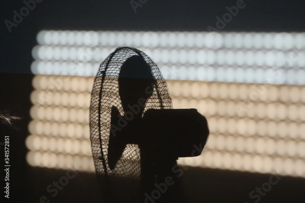 Fototapeta cooling by a fan in the summer heat