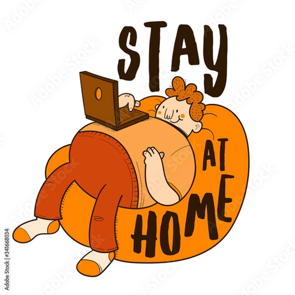Fototapeta Stay at Home. Man lying on a pouf using the computer