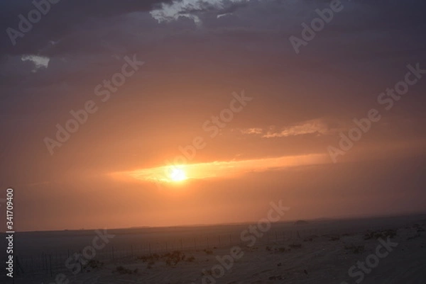 Fototapeta Dramatic sunrise in a abstract nature background.