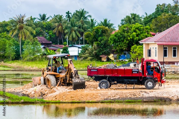 Fototapeta Editorial, Alor Setar, Kedah, Malaysia December 20th 2019. Earthwork and Construction Tractor Busy Working