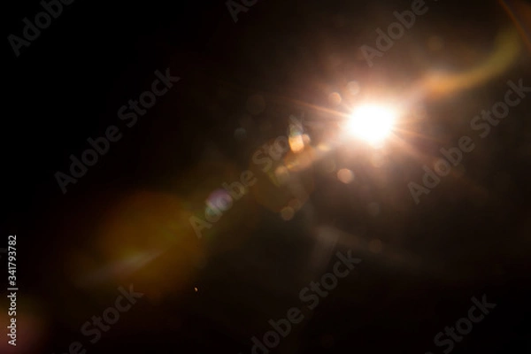 Obraz Abstract Natural Sun flare on the black background.