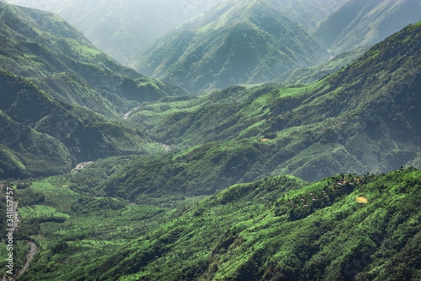 Fototapeta misty mountain range covered with white mist