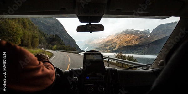 Fototapeta Driving through the winding roads Along the Fjords of Norway in an RV Camper Van 