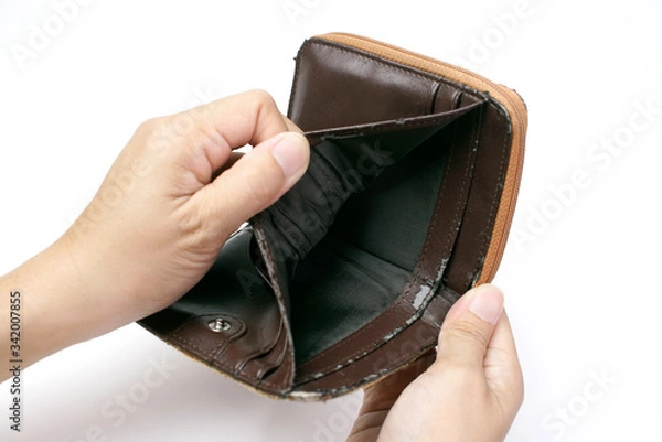 Fototapeta Lack of financial liquidity, Hand open an old empty wallet or purse on white background, , poor status                               