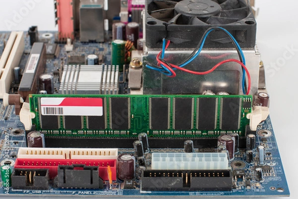 Fototapeta Main board of old desktop computer, close up of  memory module in slot on motherboard.
