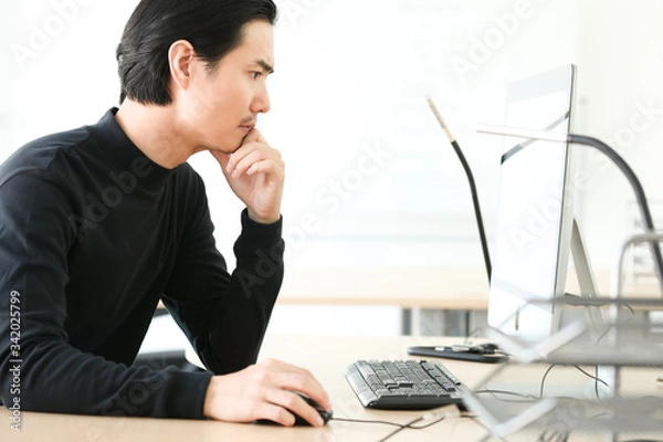 Fototapeta young designer working on computer