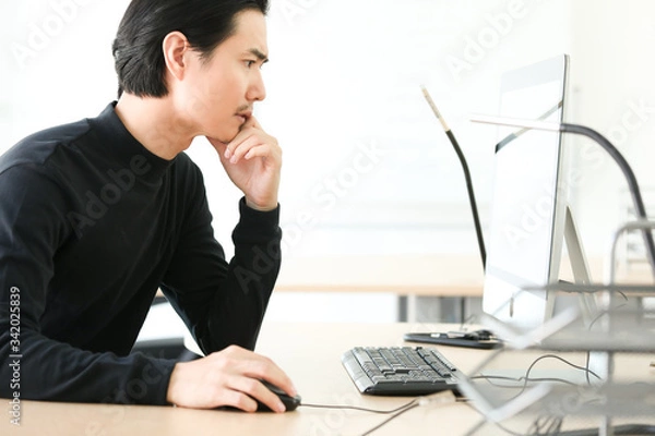 Obraz young designer working on computer