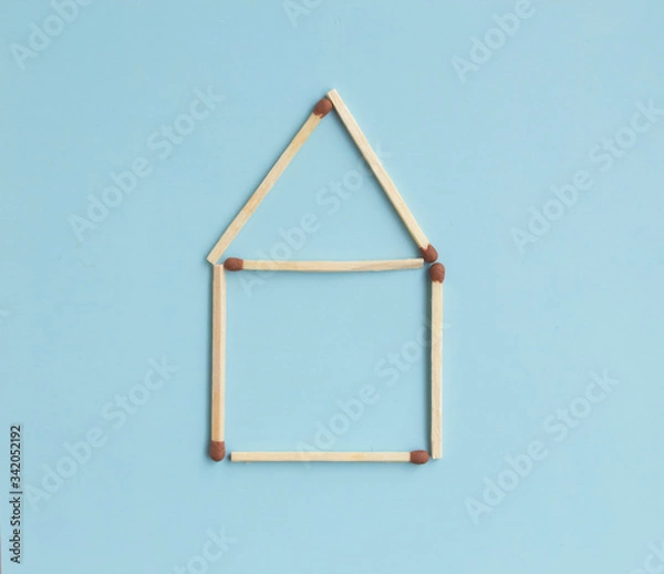 Fototapeta House of matches on a blue background with text space. Top view. Mock up. Flat lay composition