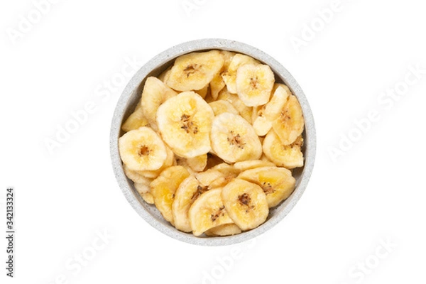 Obraz Eine Schale voller getrockneter Bananenstücke