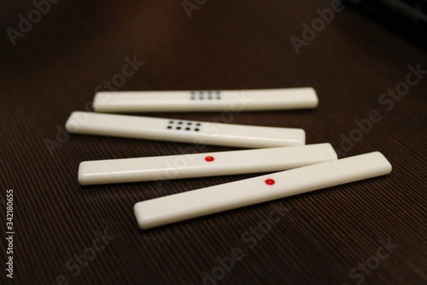 Obraz Counting sticks for mahjong are on the table, the back and side plans are blurred. Table traditional game of China, Japan, and other Asian countries.