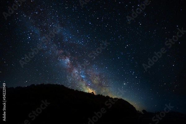 Fototapeta A fabulous starry sky with the Milky Way, a screensaver for astrology, astronomy and horoscopes and zodiacs. A clear starry sky