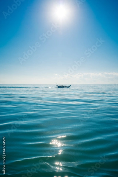 Obraz Boat sailing in the sun through the Arabigo Sea in the direction of Masirah Island, Oman
