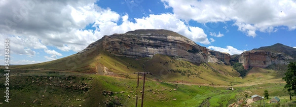 Fototapeta Fluffy clouds over rock formations in the Golden Gate Highlands National Park, Clarens, Free State, South Africa
