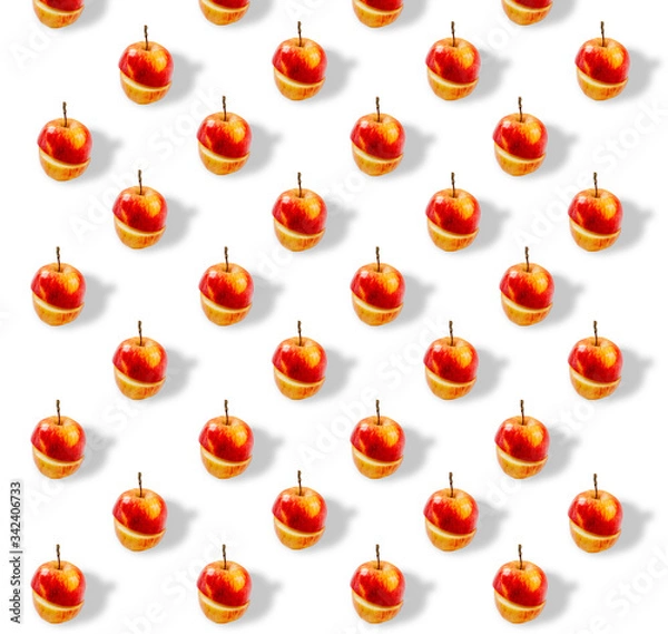 Fototapeta Trendy repeating pattern. Juicy red apples on a white background. Minimum summer concept. A banner from the same cut apples.