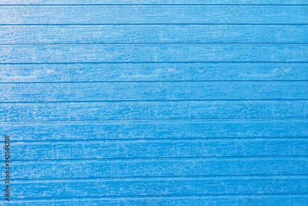 Fototapeta Wooden textured background for design with blue planks. Front view with copy space.