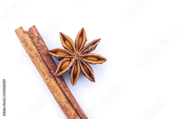 Obraz cinnamon and star anise on white background.