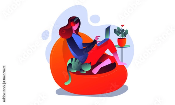 Obraz Working from home. Girl sitting in a couch and workin on laptop.