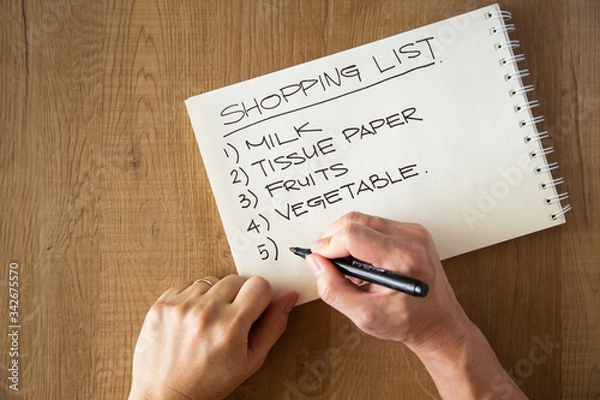 Obraz hand writing a shopping list