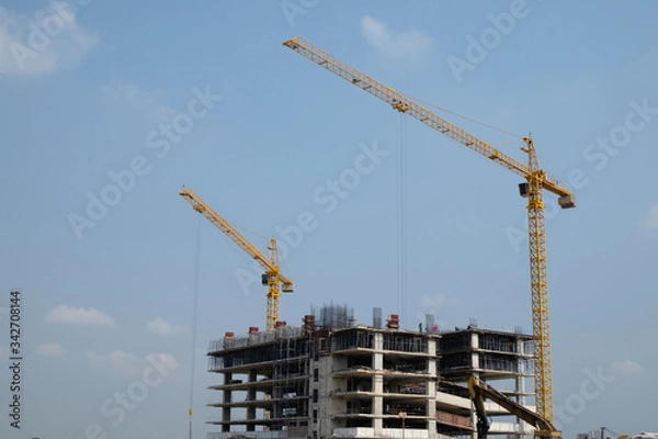 Fototapeta building construction site with blue sky background