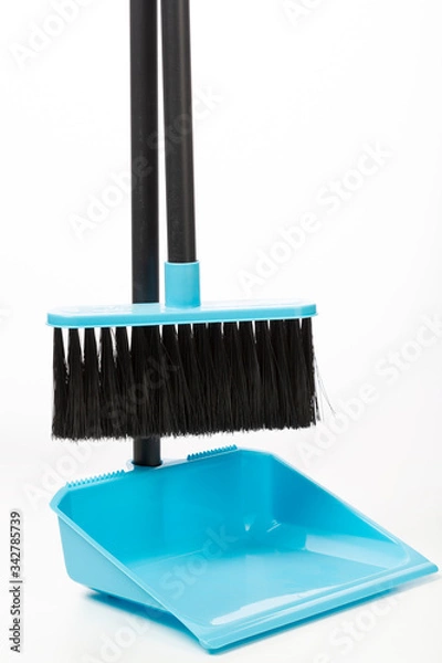 Fototapeta plastic broom in a dustpan for house cleaning isolated on a white background