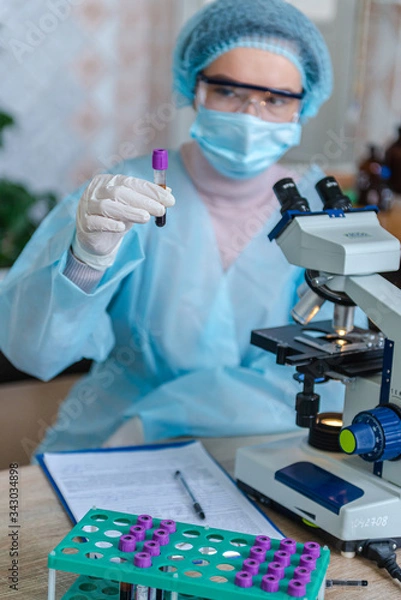 Fototapeta The scientist doctor created a vaccine against the coronavirus SARS-CoV-2 in the laboratory.
