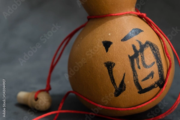 Obraz Dried bottle gourd on black background view,the chinese means is wine