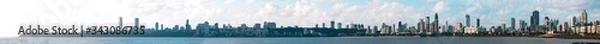 Fototapeta A super-wide panorama of the skyline seen from Marine Drive, South Mumbai. The panorama begins with Malabar Point- the tip of the Walkeshwar peninsula, and ends at where the Art Deco buildings start. 