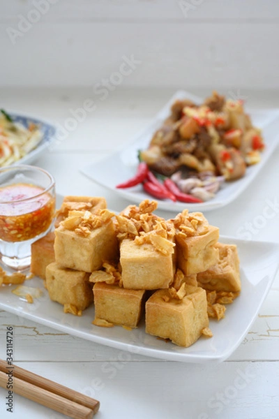 Fototapeta Deep fried tofu is cut into square balls on plate
