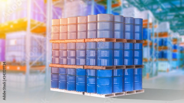 Fototapeta Petroleum products are stored in a warehouse. Concept - oil in blue barrels. Blue barrels in the middle of a large warehouse. Concept - storage tanks filled with oil. Overabundance of hydrocarbons